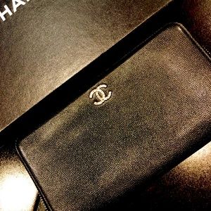 Chanel Zippy trimmed in bright Silver.